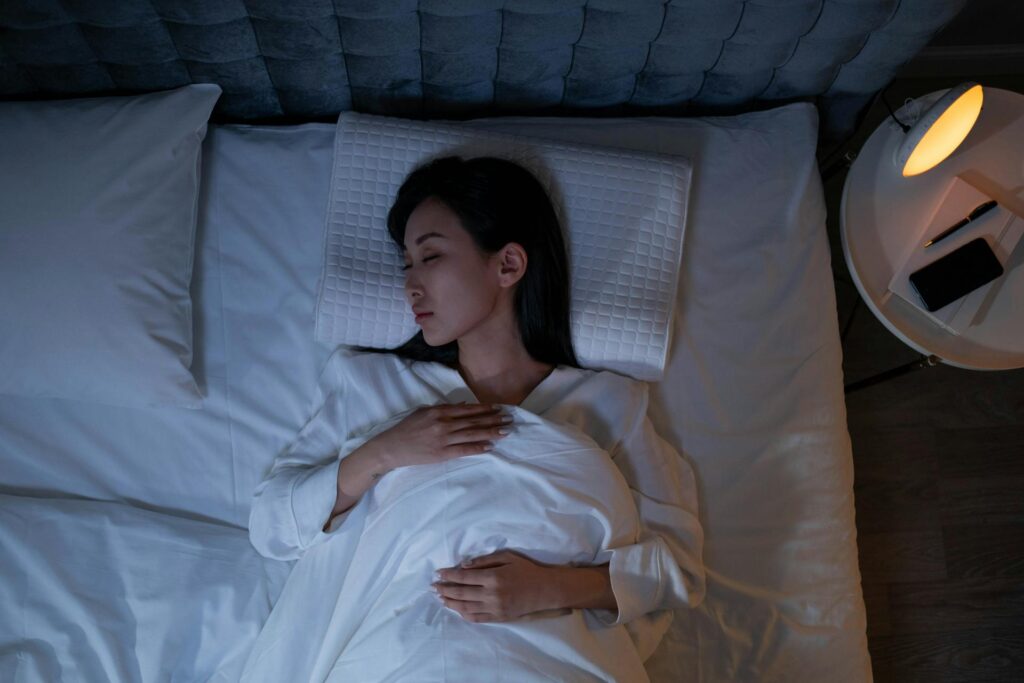 Woman practicing a calming nighttime routine before bed