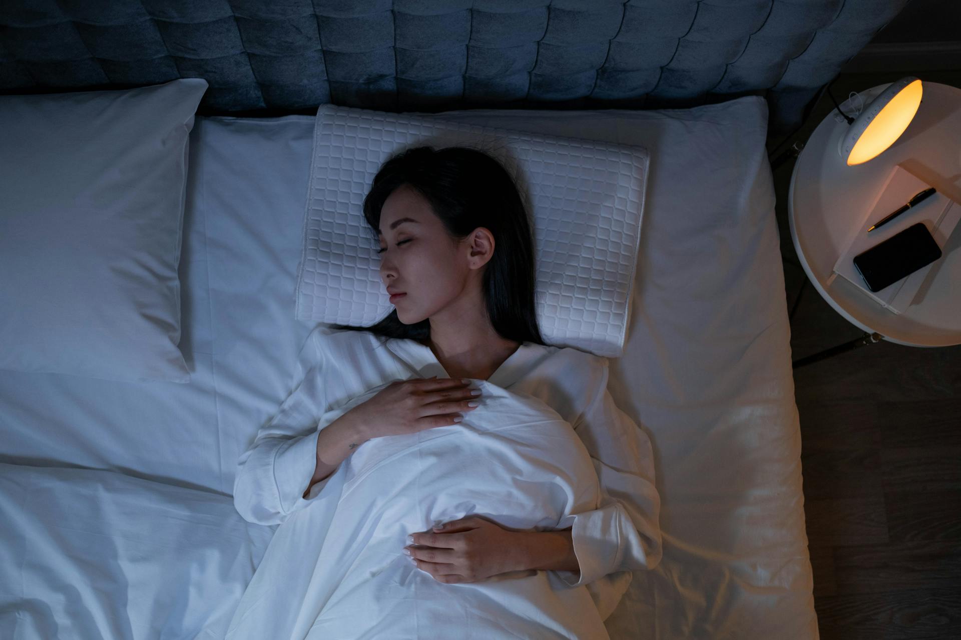 Woman practicing a calming nighttime routine before bed